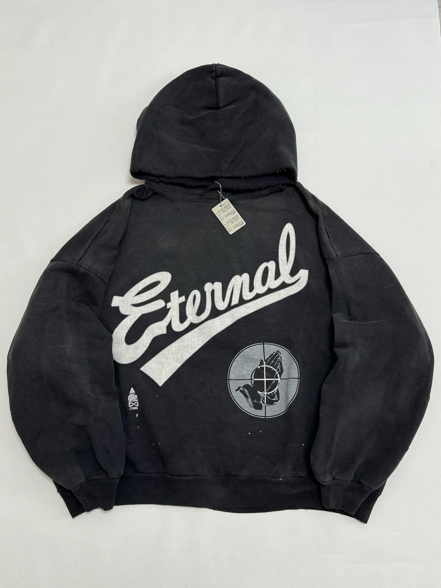 SAINT Mxxxxxx × FEAR OF GOD FG_HOODIE/SNT OF GOD/BLK FOG joint model ETERNAL praying crosshair distressed hoodie. Washed black S-XL. This season's popular super popular joint model. The original version is the same. Thin spring and summer fabrics. The upper body is comfortable. The BOXY version of the short fat wide shoulder line. Fashion darling wears it with a high-end feel. Heavy washing and water fading technology. The horse is repositioned. Excessive wear and damage graffiti treatment. Correct version FOG joint main mark/wash mark/little angel mark